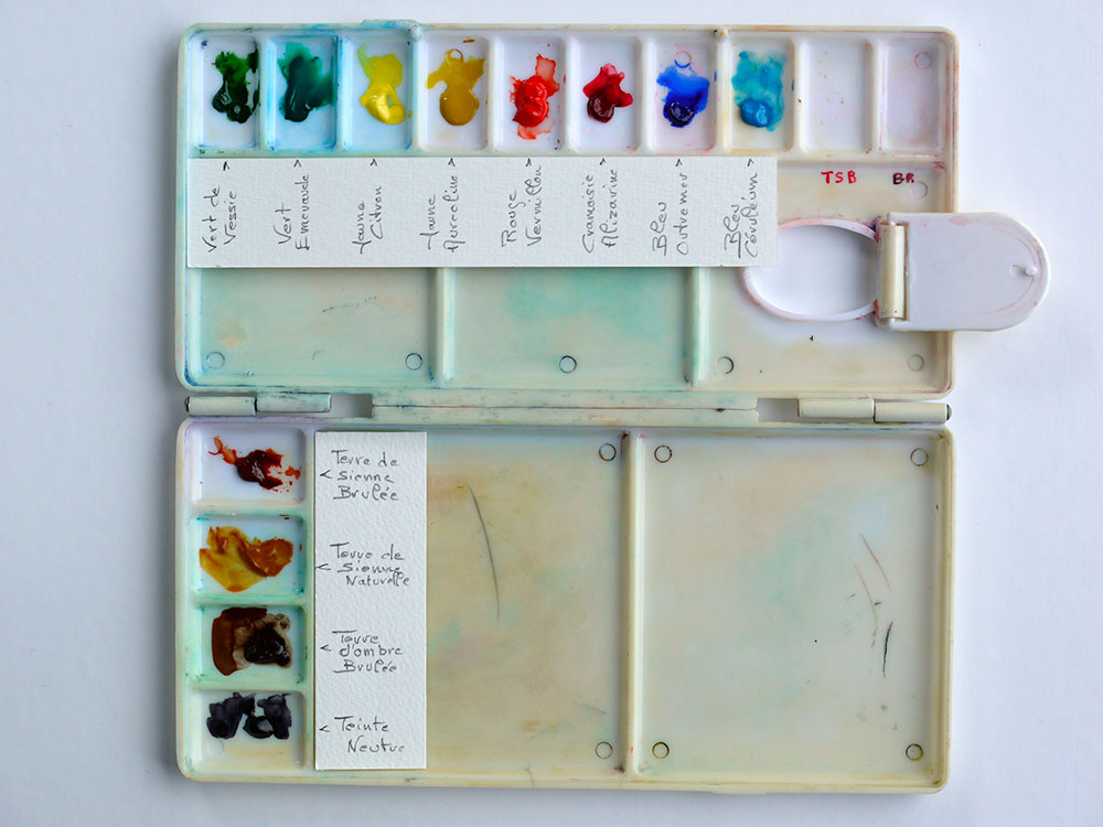 photographie d'une palette de peinture avec des annotations décrivant la couleur associé